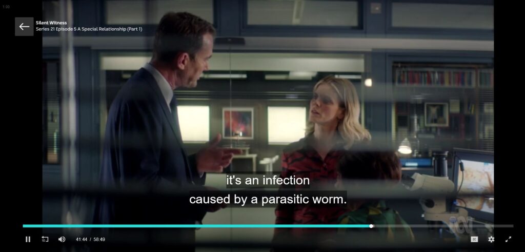 Screenshot from the television program Silent Witness. A man is speaking to a woman and the caption reads "it's an infection caused by a parasitic worm."